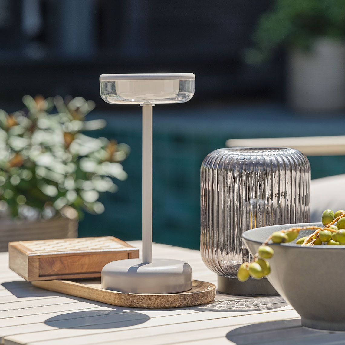 HUMLEBI battery-powered, outdoor table lamp Outdoor table lamp adorning a lounge table