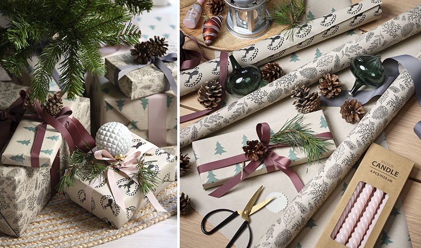 Cadeaux de Noël décoré avec boules de Noël, branches de pin, pommes de pin