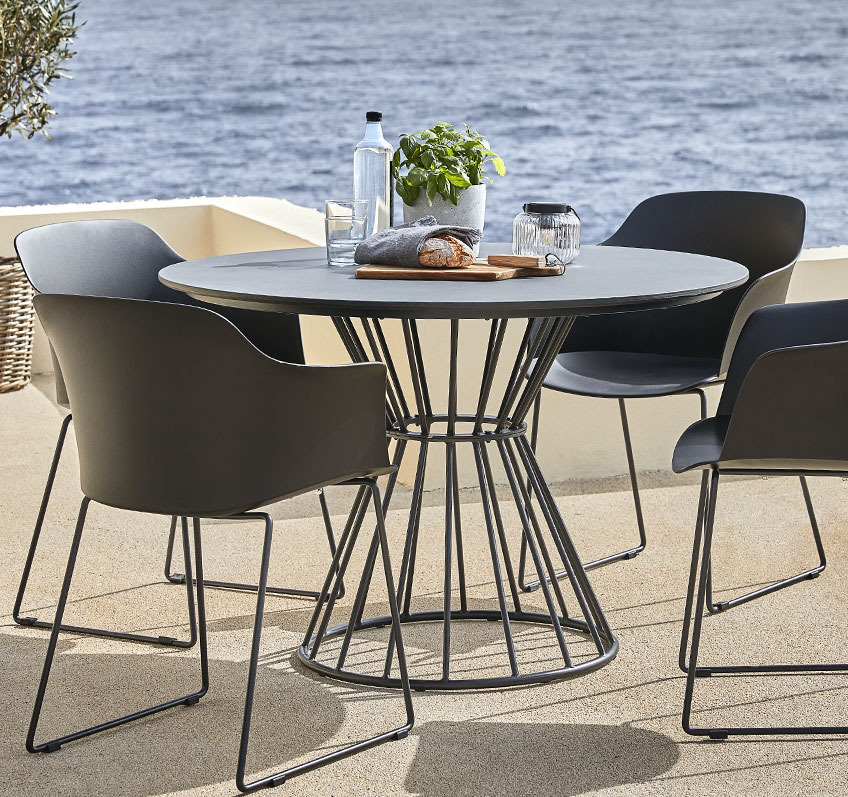 FAGERNES garden table and SANDVED garden chairs Round garden table in metal and fibre cement and four garden chairs